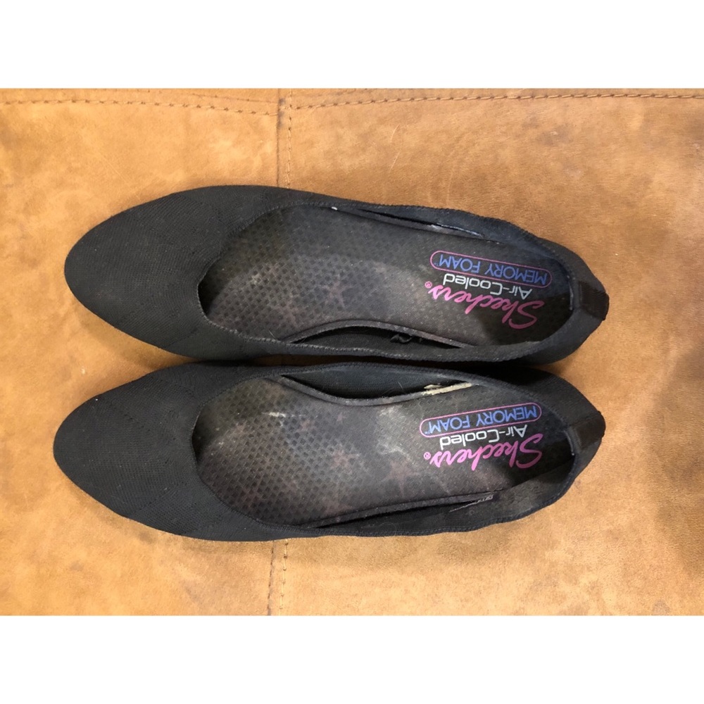 Black sketcher slipons